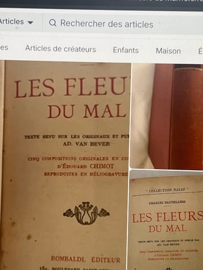 The image displays a photograph of a digital screen, likely a computer monitor, showing a web interface and multiple images of books. The top portion of the screen features a search bar labeled "Rechercher des articles" and category tabs including "Articles de créateurs," "Enfants," and "Maison," indicating an online marketplace or catalog.
The main subject consists of three book-related images presented below the web interface. On the left, a book's front cover is prominent, displaying the title "LES FLEURS DU MAL" in large red letters, attributed to Charles Baudelaire. Further text indicates it is "TEXTE REVU SUR LES ORIGINAUX ET PUBLIÉ PAR AD. VAN BEVER," with "CINQ COMPOSITIONS ORIGINALES EN COULEURS D'ÉDOUARD CHIMOT REPRODUITES EN HÉLIOGRAVURE." The publisher is listed as "ROMBALDI, ÉDITEUR," with the address "184, BOULEVARD SAINT-GERMAIN." An ornate, dark decorative emblem is situated mid-cover.
To the top right, a partial view of a reddish-brown hardcover book spine is visible, featuring a gold horizontal band near the top. Below it, to the bottom right, another book cover for "LES FLEURS DU MAL" is shown. This cover is labeled "COLLECTION BALDI" and also credits Charles Baudelaire, Ad. Van Bever, and Édouard Chimot, with text details matching the larger cover on the left. Both visible book covers are light-colored with red lettering.
No discernible information within the image identifies a location in Le Perreux-sur-Marne, France. The publisher's address provided on the book is 184 Boulevard Saint-Germain, which is located in Paris.