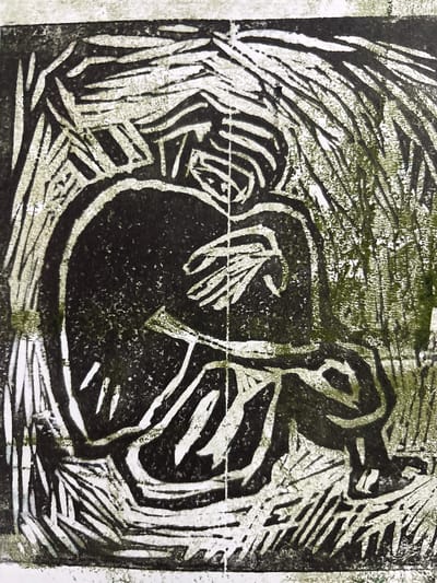 This is a black and white linocut print of a person curled up in a fetal position, appearing to be sheltering amongst stylized reeds or grass. The figure is dark and solid, with lighter lines suggesting the form of the body and arms wrapped around the knees. The background is composed of energetic, radiating lines that create a sense of enclosure or movement. There is a subtle green hue in some of the lighter areas, suggesting aged paper or a slight tint in the ink. The image has a grainy texture characteristic of linocut printing. The location in Jrarat, Armenia is not depicted in the image itself.