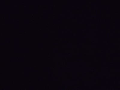 The media file is an extremely dark, almost black image. There are no discernible subjects, objects, scenes, or activities taking place. It is not possible to determine the time of day, weather, location cues, or emotions from this image. There is no visible text. The image appears to be underexposed or entirely black.