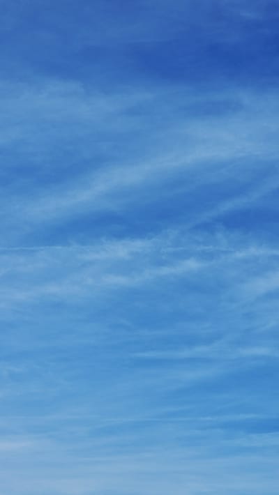 The image depicts a light blue sky with thin, wispy cirrus clouds. The scene appears to be a daytime shot, with no visible subjects, objects, or people present. It's impossible to determine the specific location within the city of Lincoln, United Kingdom from the provided image alone.