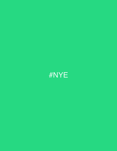 The image displays a solid, vibrant green field with the white text '#NYE' centered, representing a digital display or graphic element within a New Year's Eve scene in Antigua Guatemala, Guatemala. The depicted environment is an illuminated public square or street in the city, characterized by traditional colonial architecture and cobblestone surfaces. Numerous individuals, dressed in festive attire, populate the area, engaged in various social actions such as congregating, conversing, and observing the celebration. Specific objects include temporary vendor stalls, decorative lights, and personal belongings. Interactions are primarily festive, involving lively communication and collective anticipation of the New Year. The green background and '#NYE' text function as a prominent informational or celebratory visual within this bustling urban setting.