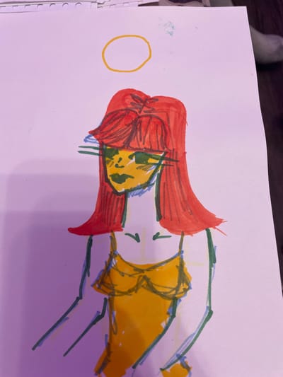 The image is a drawing on white paper of a person with red hair, yellow skin, and green eyes. The person is wearing a yellow top. A yellow circle is drawn above the person's head. The drawing is done with markers. The background is a pinkish-purple color. There is no indication of Vaganovo, Russia in the image.