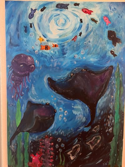 This is a painting depicting an underwater scene. The main subjects are various marine creatures, including a large dark whale-like animal, a ray or manta-like creature, a purple jellyfish, and several fish of different sizes and colors, some with black bodies and others red, pink, and orange. There are also abstract representations of coral or anemones in red and pink.
The scene appears to be in motion, with swirling blue currents indicated by brushstrokes, and bubbles scattered throughout the water, suggesting a dynamic environment. A vortex-like swirl is visible on the left side of the painting. The overall impression is one of a vibrant and lively underwater ecosystem. The color palette is dominated by blues, with accents of black, purple, red, pink, and yellow. The painting has a somewhat stylized and simplified representation of the creatures.
There are no visible human figures. The time of day and weather are not determinable from an underwater scene. The location is implied to be the ocean or a large body of water. No text is visible in the image.