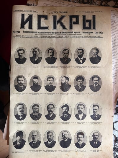 The image is a scan of the front page of a Russian newspaper titled "ИСКРЫ" (Iskry), dated "Воскресенье, 27 мая 1907 года" (Sunday, May 27, 1907). The newspaper is a weekly illustrated literary and humorous journal with caricatures, published as issue number 20.

The page is dominated by a large title "ИСКРЫ" in bold, stylized font. Below the title, there is a description of the publication, including its price and subscription details. The majority of the page is filled with a grid of oval portraits of men, arranged in rows and columns. Each portrait is accompanied by a caption identifying the person, their profession, and their place of origin, typically a guberniya (province) in Russia.

The men depicted are presented in formal attire, suggesting they are notable figures. The captions indicate a variety of professions, including landowner, merchant, peasant, doctor, military official, and various other professions. The locations mentioned in the captions are spread across different regions of the Russian Empire, such as Astrakhan, Samara, Kazan, Kaluga, Tula, Simbirsk, and others.

There is no depiction of the city of Ust'-Kabyrza, Russia, within this image. The image is solely of a printed newspaper page.