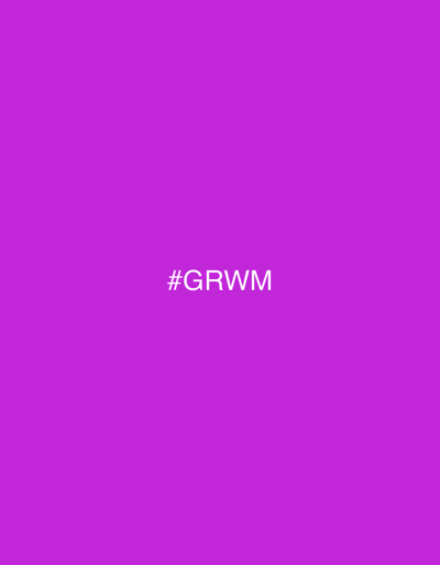 The image is a solid, vibrant purple background with white text in the center that reads "#GRWM". The text is in all capital letters and appears to be a hashtag commonly used on social media platforms, often signifying "Get Ready With Me," which typically accompanies videos or posts detailing personal grooming or outfit preparation. There are no other discernible subjects, objects, scenes, or activities depicted in the image. The setting is abstract due to the lack of visual cues, and there are no indicators of time of day, weather, or specific location beyond the provided context of Basiglio, Italy. The overall emotion conveyed is neutral and direct, focusing on the presentation of the hashtag.
