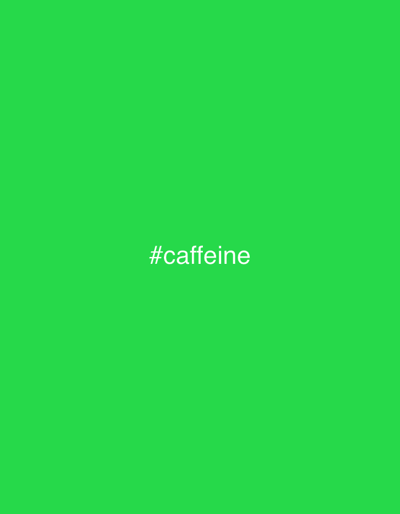The image is a photograph of a bright green background with the text "#caffeine" in white font centered on the lower half of the image. The image does not depict any location in the city of Khor, Russia, nor does it contain any people, subjects, objects, or actions.