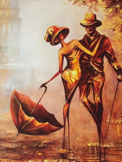 The image is a painting depicting a couple in a stylized, almost surreal, urban setting. The man is on the right, wearing a suit, hat, and holding a cane. The woman is on the left, in a flowing dress and hat, holding a closed umbrella. They are in a close embrace, suggesting a romantic connection. The background features an architectural element resembling a dome, possibly a building, on the left, and hints of foliage or trees on the right. The color palette is dominated by warm, earthy tones of orange, brown, and gold, creating a dramatic and textured effect. The style is impressionistic, with visible brushstrokes and a focus on light and shadow. The painting does not depict any identifiable location within the city of Oldham, United Kingdom.