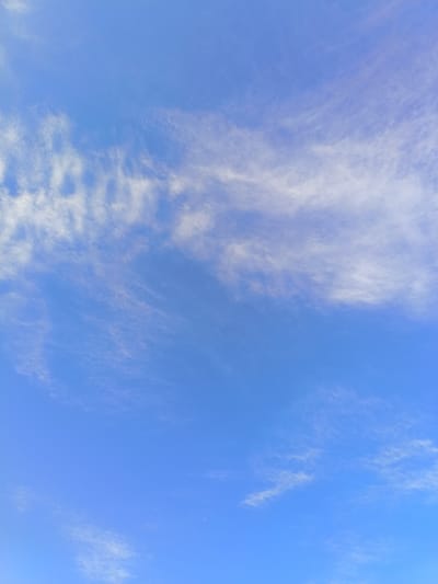 The image shows a clear blue sky with wispy, white cirrus clouds. The sky is a dominant feature, filling almost the entire frame. The clouds are scattered and appear to be thin and feathery, suggesting fair weather conditions. There are no visible landmarks, people, or objects in the scene, making it a purely atmospheric view. The lighting indicates it is daytime. This image is of the sky above Skravena, Bulgaria.