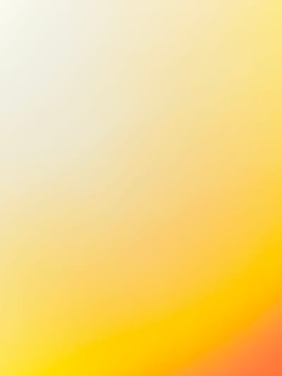 The image displays a gradient of colors, transitioning from a pale yellow at the top left to a bright orange at the bottom right. There are no discernible subjects, objects, actions, interactions, or environmental details present in the image. Therefore, it is not possible to provide any information regarding its location in the city of Volga, Russia.