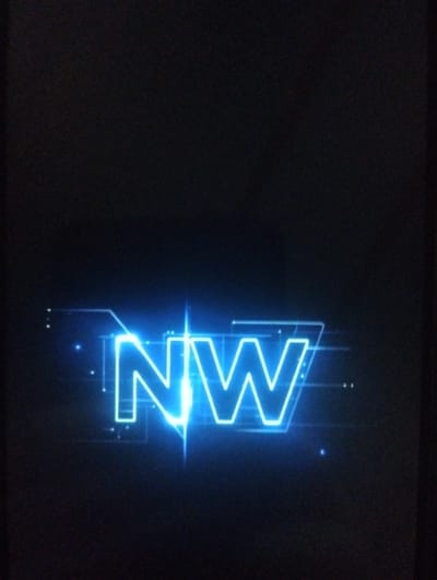 A dark background showcases a futuristic, neon-blue logo of "NW". The letters are outlined in a sharp, geometric style, with bright flares emanating from the center point between the letters. Faint lines and small dots surround the letters, creating a digital, technological feel. The overall composition is simple yet striking, drawing attention to the glowing logo against the deep black background.