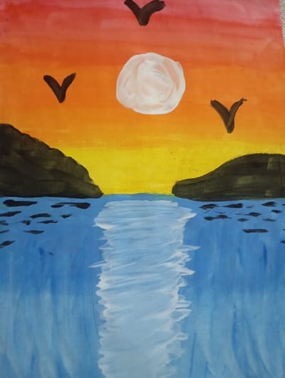 The image is a watercolor painting depicting a sunset over a body of water. Two dark, rocky landmasses frame a central channel of blue water, which reflects the bright yellow and orange hues of the sky. The sky transitions from red at the top to orange and then yellow towards the horizon. A pale, circular sun is visible in the upper center of the sky, with three dark, V-shaped birds in flight. Several dark, elongated shapes are scattered on the surface of the water, possibly representing boats or debris. The water exhibits white highlights, suggesting the reflection of the sun. The overall impression is a serene, natural landscape. The painting does not contain any elements that would place it specifically in Pirallahi Raion, Azerbaijan.