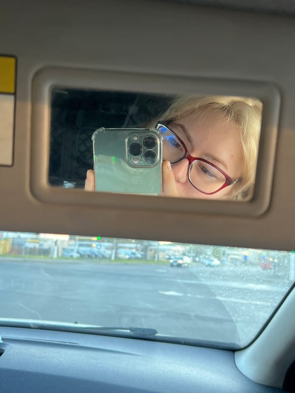 Person takes selfie near Ukrainian billboard in Odesa