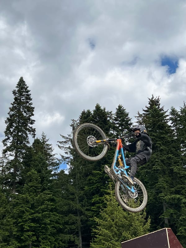 Mountain bikers perform aerial stunts near Samokov, Bulgaria