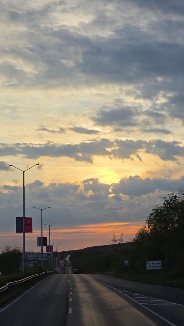 Sunset documented on Veliko Tarnovo road with illuminated clouds