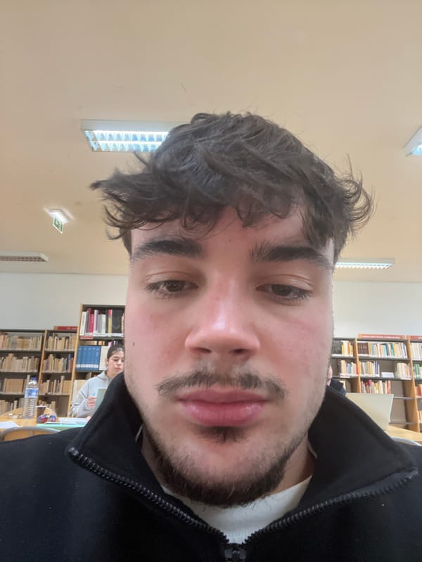 Student Takes Multiple Selfies in Bragança Library Study Session