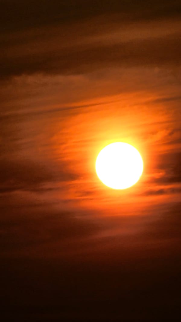Sun and clouds over Asan-si on a shifting June morning
