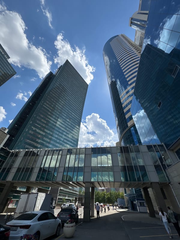 Astana's glass towers against a clear summer sky