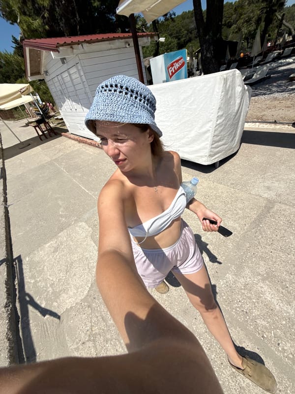 Beach day documentation captures woman, umbrellas, dining in Montenegro