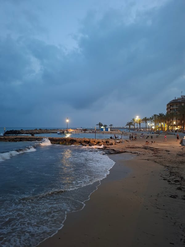 Torrevieja beachfront promenade at dusk, summer evening