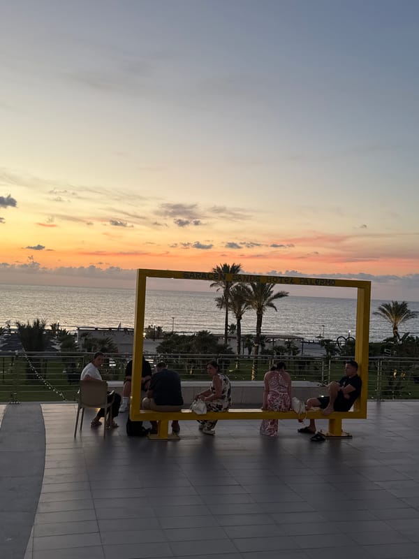 Sunset gathers at a Sicilian coastal resort's waterfront