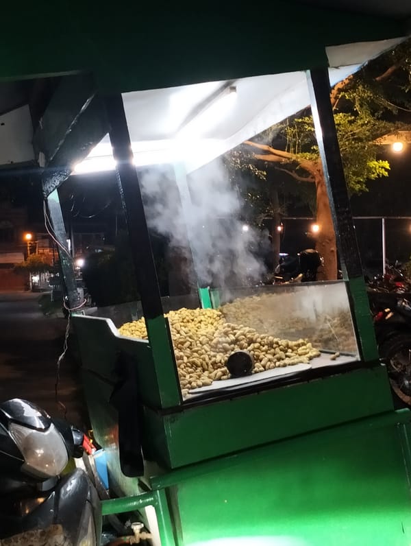Street vendor sells steaming peanuts in Lhokseumawe