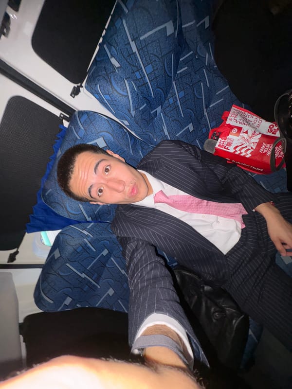 Suited man takes selfie lying on Mexico City bus