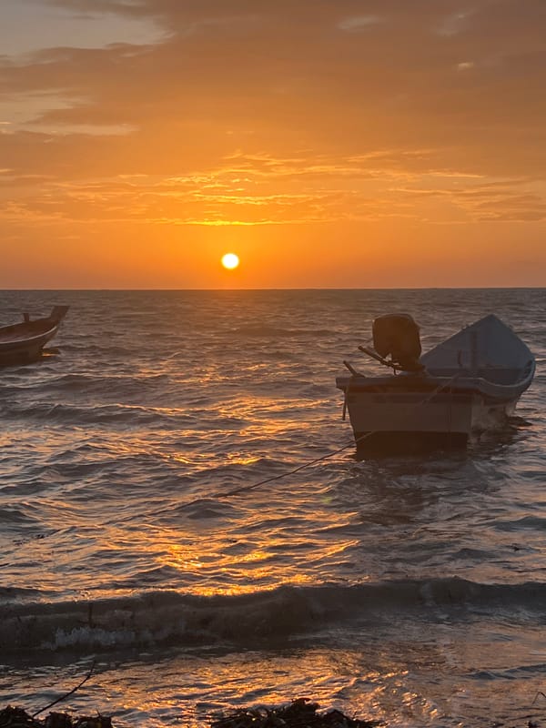 Ko Pha-ngan sunset over open water, golden hour.