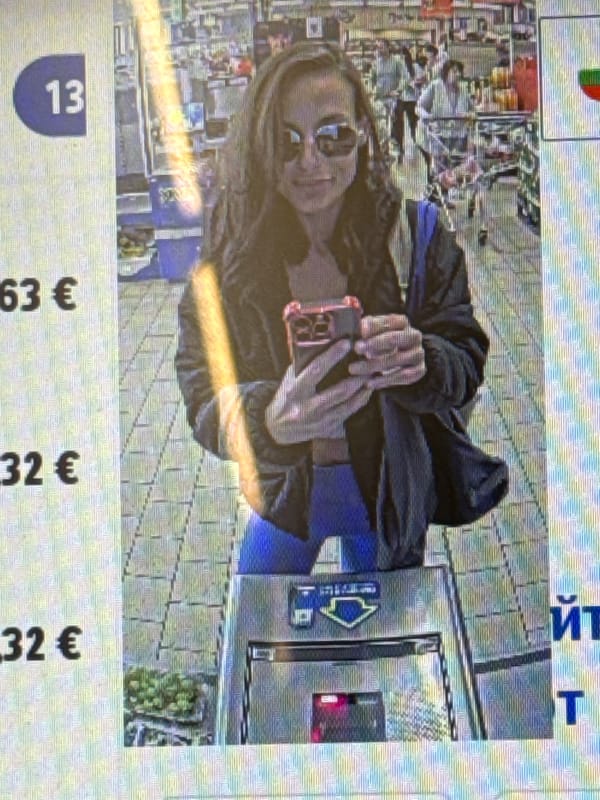 Woman takes selfie near vending machine in Pleven, Bulgaria