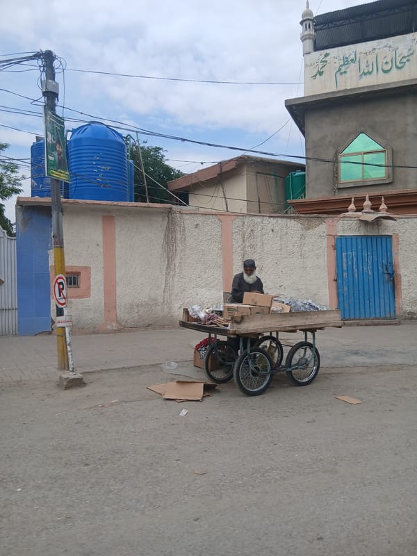 Street vendor operates bicycle cart in early morning Quetta