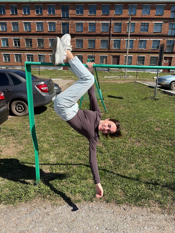 Adults use playground equipment in Neftekamsk, Russia