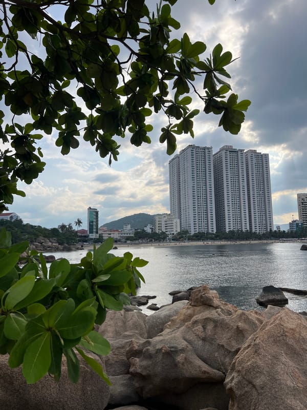 Nha Trang's rocky coast and city streets on a June morning