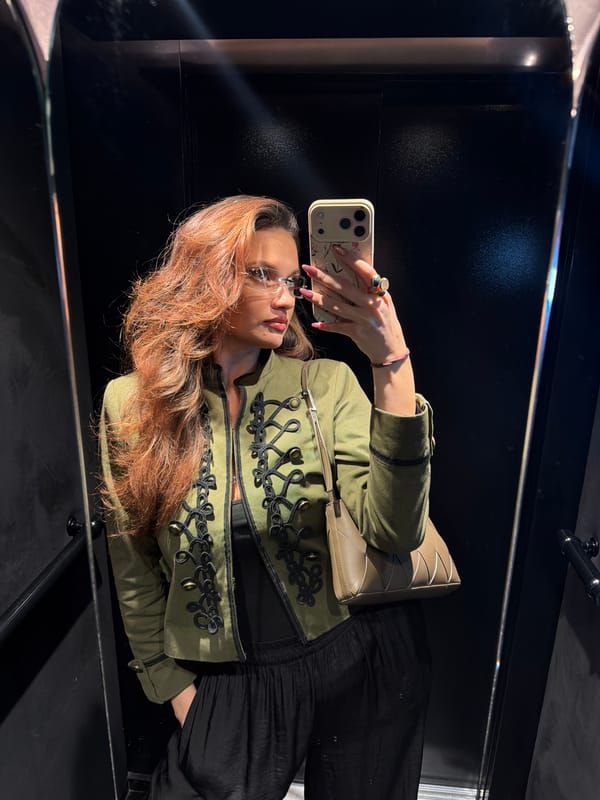 Woman takes mirror selfie in Athens