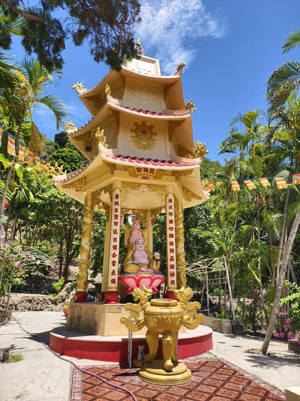 Gold pagoda with Buddha statues observed in Tay Nha Trang