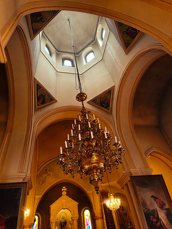 Georgian church interior with ornate chandelier and dome