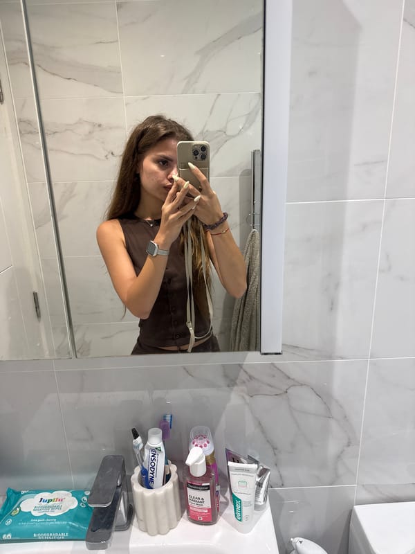 Mirror selfie in a Throop bathroom, June 2026