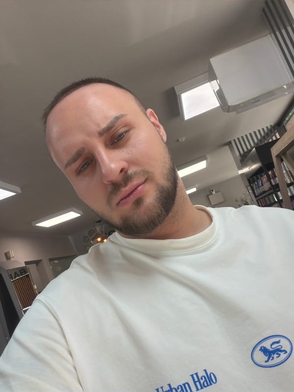 Close-up selfie in Sofia wearing a branded white sweatshirt