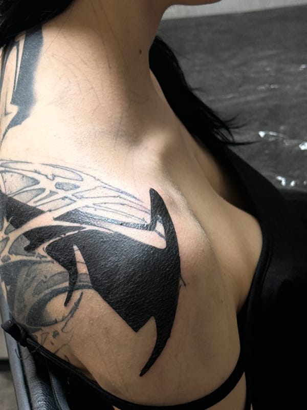 Person displays large orca whale tattoo in Moscow