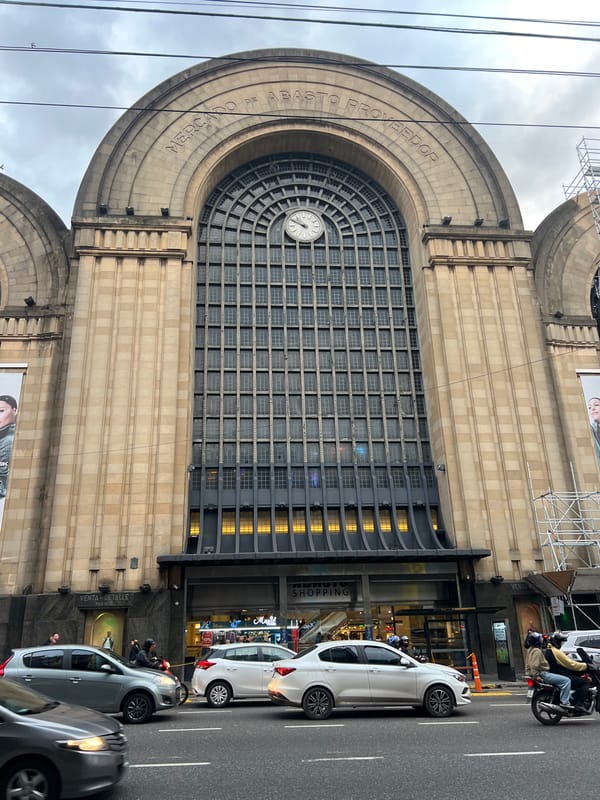 Evening street activity documented around Buenos Aires Abasto Shopping area