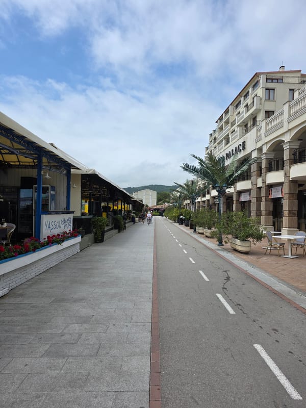 Tourist explores Balchik Bulgaria's promenade, pier, and coastal attractions