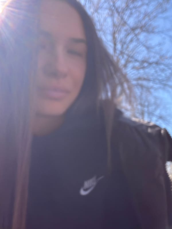Woman in Nike hoodie photographed in Sofia morning