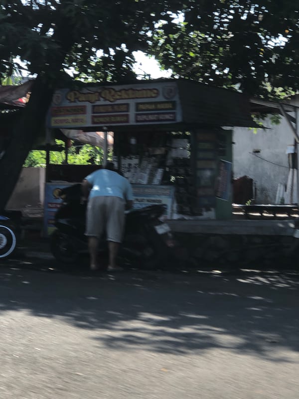 Everyday street life along Indonesian roadside in Buduran