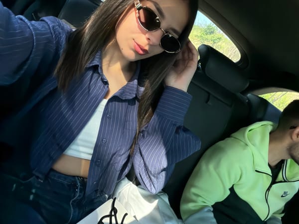 Two people rest inside vehicle in Debelets, Bulgaria