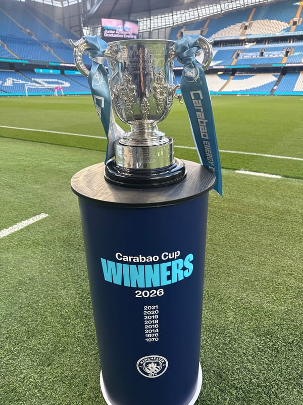 Carabao Cup trophy displayed on Manchester football field