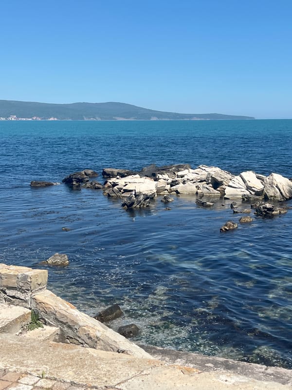 Tourist documents morning scenes in historic Nesebar, Bulgaria coastline