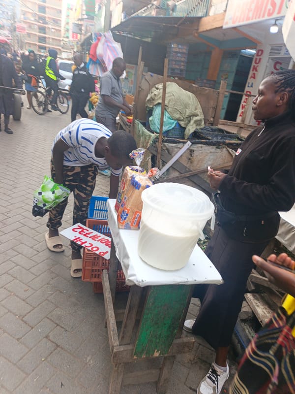 Street vendors conduct business on rainy Nairobi morning