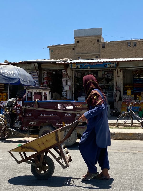 Morning street activity near a Kandahar market