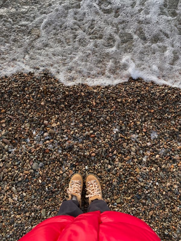 Winter visitor explores icy Lake Baikal shore in Listvyanka
