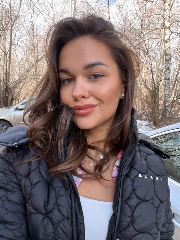 Woman photographed in casual outdoor portrait in Krasnoyarsk