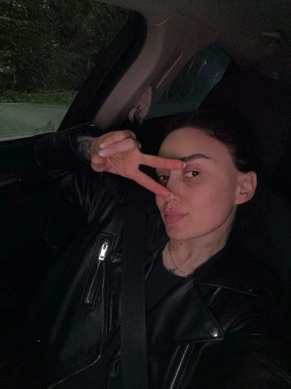 Nighttime car journey documented through selfies and street scenes in Tbilisi