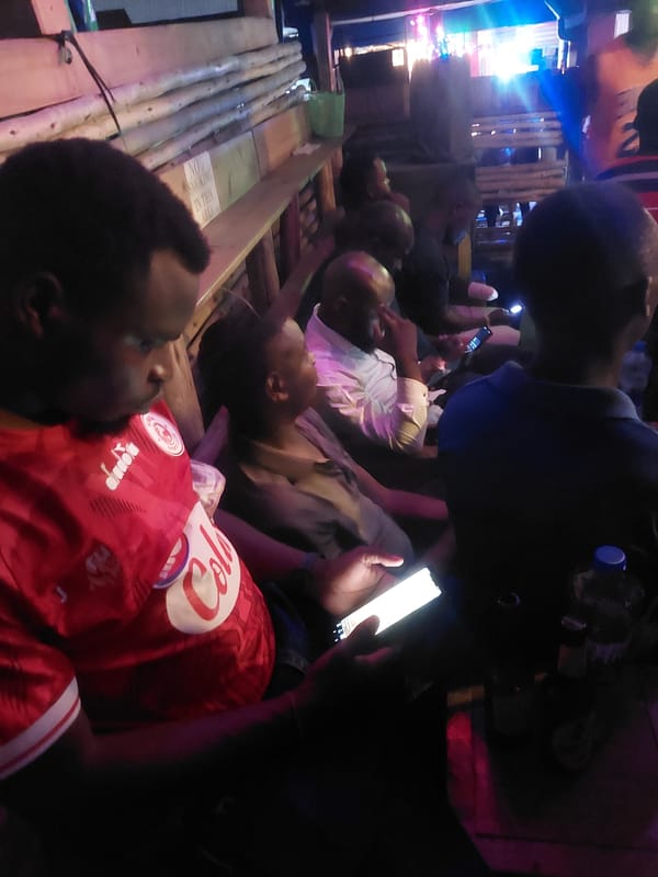 Evening social gathering documented at outdoor venue in Dar es-Salaam